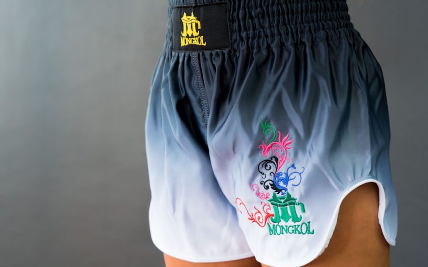 A woman wearing a pair of blue and white shorts