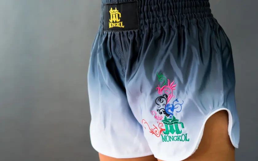 A woman wearing a pair of blue and white shorts