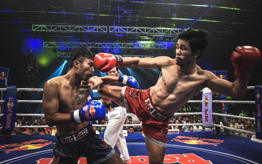 Muay Thai boxer kick opponent