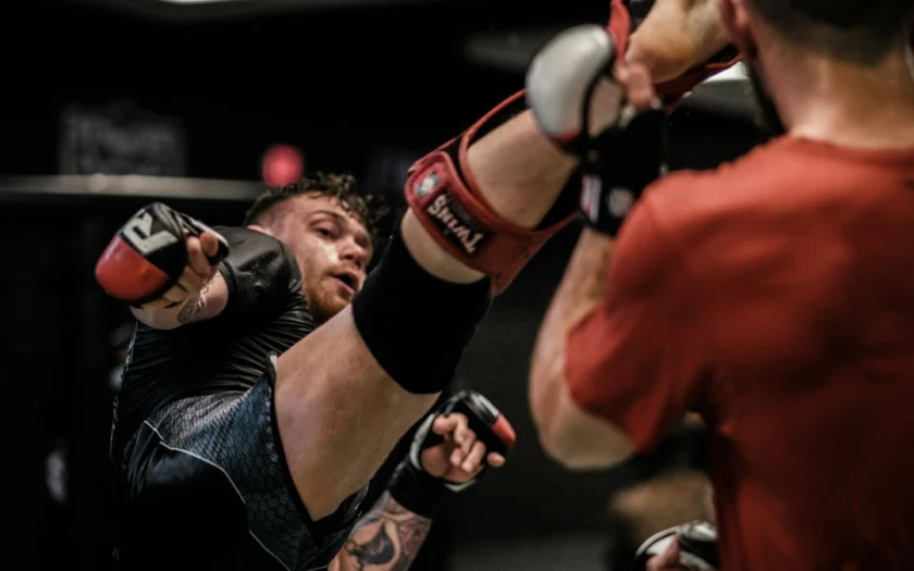 2 men in red and black boxing gloves